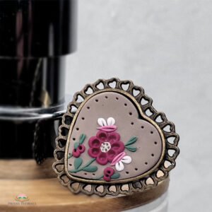 Maroon and white floral finger ring